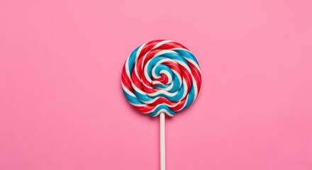 Vibrant swirl lollipop candy isolated on a soft pink background sweet treat