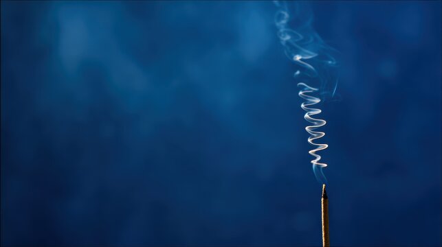 incense. A single incense stick releasing a gentle spiral of smoke against a deep blue background. event programs, museum guides, designed for cultural heritage projects and event programs.
