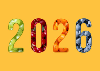Numbers 2026 with fruits inside on orange background. New Year card