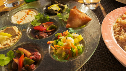 Traditional Egyptian meal with a variety of colorful dishes served during a vacation, showcasing local flavors and culture.
