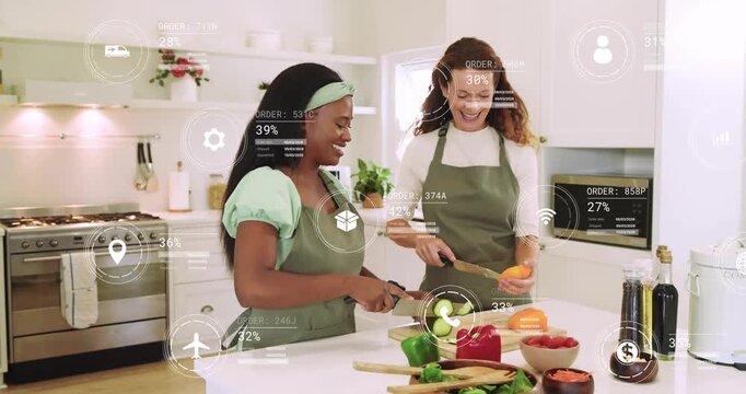 Two women slicing cucumber and halving pepper for salad while digital icons flickering around them