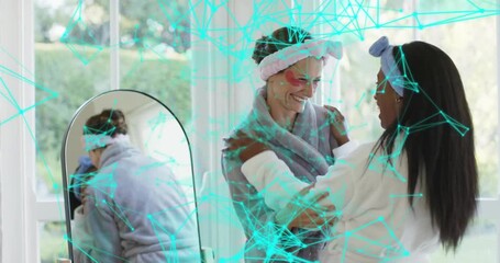 Mature woman reaching cotton pad by mirror and starting skincare routine while friend offering tips - Powered by Adobe