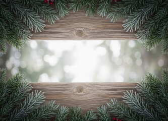 Frosted Evergreen Branches Border on Rustic Wood