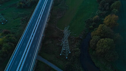 Highway and power transmission tower aerial view