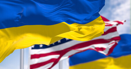 Ukraine and US national flags waving on a clear day