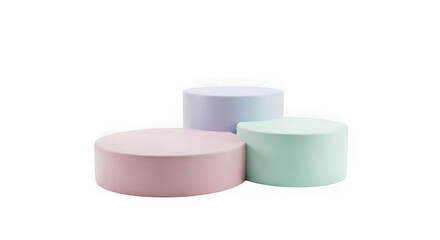 Three pastel colored cylindrical objects arranged on a black background