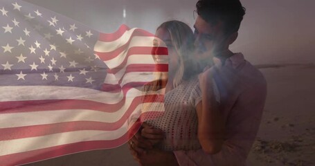 Ad showing flag overlay waving causing couple embracing on beach at dusk with flare - Powered by Adobe