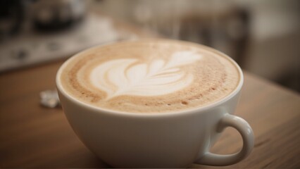 Photorealistic close-up of a cappuccino with detailed latte art in a cozy morning scene on a wooden table