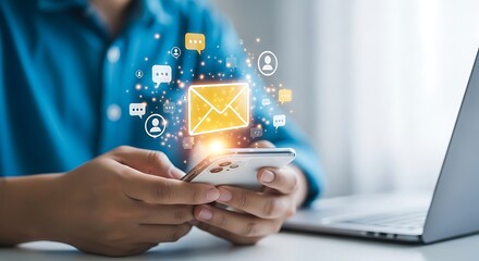 Person Holding Smartphone with Glowing Email and Chat Icons Floating Above communication