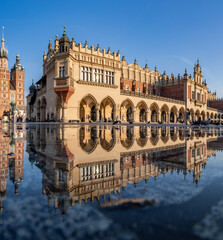 St Mary's church and Cloth Hall on Main Market Square in Krakow, reflecting in the water