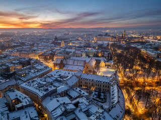 Aerial dawn view of snow covered Old City with St Francis church and Wawel Castle in Krakow, Poland