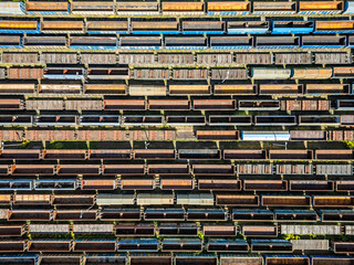 Many railroad cars (rail cars) of different cargo types on multiple parallel railway tracks, seen from above the railway station