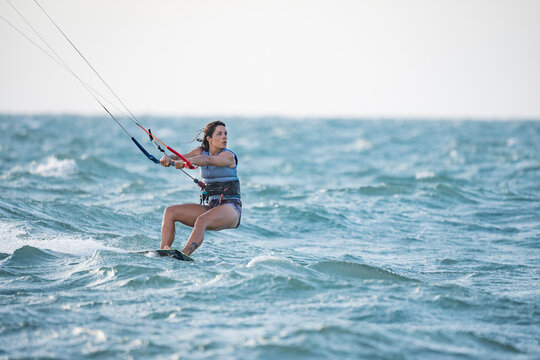 Woman kitesurfing in Mayapo, La Guajira, Colombia