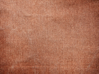Brown jeans denim fabric texture background with diagonal weawing. Closeup, macro jeans background. Design element.