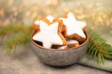 Fototapeta premium Cinnamon stars, Zimtsterne traditional german christmas cookies, gingerbread with anise spice for winter holiday