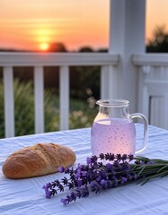 Refreshing lavender drink and bread on a table at sunset  
