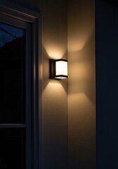 An exterior wall-mounted light fixture illuminating a house entrance at dusk, providing a welcoming glow and enhancing curb appeal ,outdoor ,fixture ,lantern