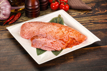 Raw marinated duck breast for cooking