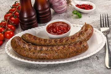Grilled beef sausages with sauce