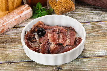 Canned anchovy with oil in the bowl