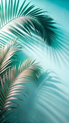 Palm leaves casting shadows on a turquoise wall in a tropical setting