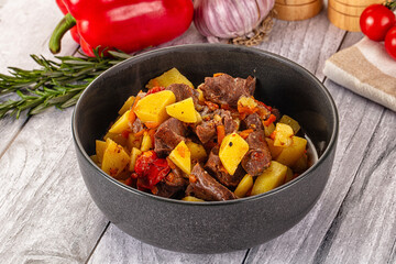 Rogiut with meat, potato and tomatoes
