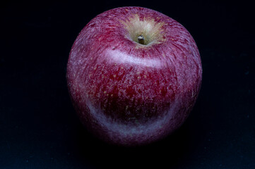 A composition of a typically autumnal fruit, such as the Annurca apples from Campania, which enhances its beauty and details.