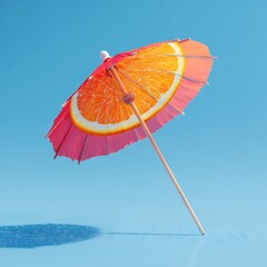 Single cocktail umbrella open and vibrant floating slightly above a surface fun and tropical isolated on a plain blue background