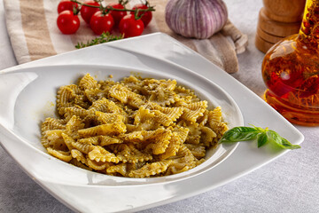Italian green pasta farfalle with pesto