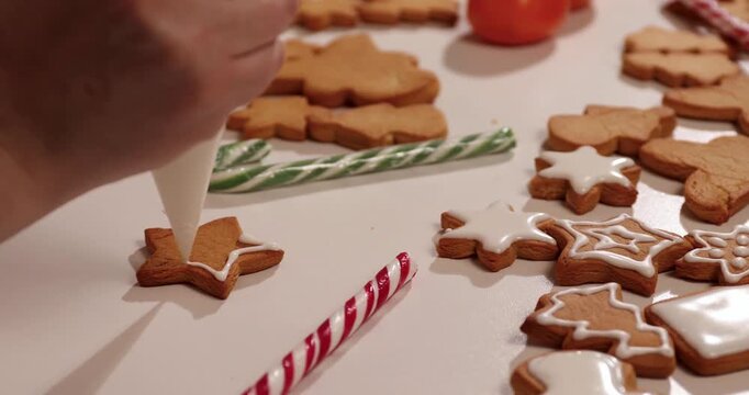 Get ready for Christmas by making delicious gingerbread cookies from scratch. Watch as festive shapes are decorated with colorful icing and sprinkles, perfect for holiday sharing.