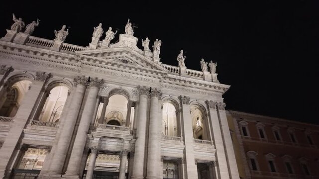 The facade of San Giovanni in Laterano under the Roman night sky
