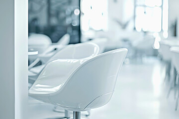 Modern white office. Modern white chair positioned in bright, minimalist interior space, featuring soft lighting and clean lines, creating serene atmosphere