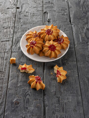 Top View of Raspberry Jam Cookies on Rustic Wooden Surface