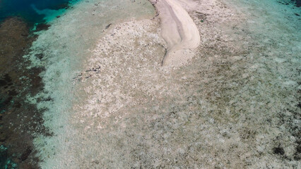 Scenic aerial landscape of Pulau Karangan Komodo highlighting coral reef and clear tropical sea
