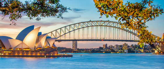 Sydney Harbour Bridge and Opera House Glowing in Evening Blue Hour