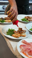 Gourmet appetizer platter with a variety of Italian antipasti beautifully arranged on a wooden board