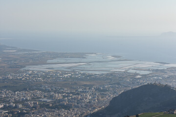 Saline Di Trapani saltworks, view from Erice. Scenic panoramic view from Erice town at sea coast in Sicily, Italy, Europe. The Mediterranean Sea. Vacation in Sicily. Travel to Italy. Summer. 