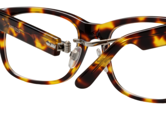 Opulent, polished tortoise shell eyeglasses with intricate amber, auburn, and umber patterns, gleaming silver hinge, pristine clear lenses, on transparent background. Concept for luxury eyewear