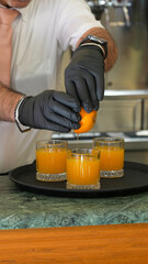 Healthy homemade orange juice preparation with vibrant fresh oranges in a glass