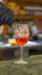 Refreshing Aperol Spritz cocktail served with ice and orange slice for a delicious aperitivo