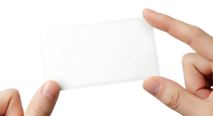 A person holding a blank white card between their fingers against a black background studio shot