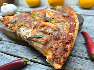 Delicious pizza lying on the table.