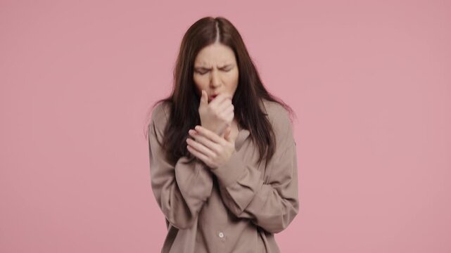 Young Woman Has Sore. Sick Lady With Swollen Throat Coughs On Pink Studio.Angina
