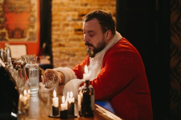 Santa claus taking a stressful holiday drinking break