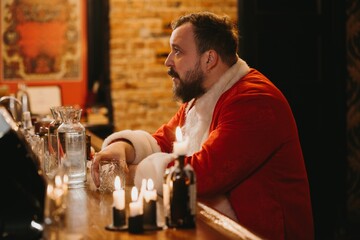 Santa claus taking a break at bar counter