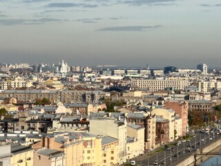 Saint Petersburg. Top view of the Obvodny Canal embankment, the rooftops of the historic city center, and Smolny Cathedral in the distance. An unusual panoramic cityscape