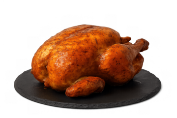 Whole roast chicken serving on black slate board, golden delicious poultry ready for dinner, transparent background