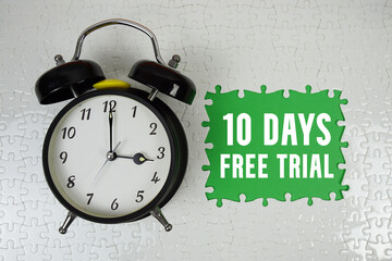 10 Days Free Trial text with alarm clock on green background