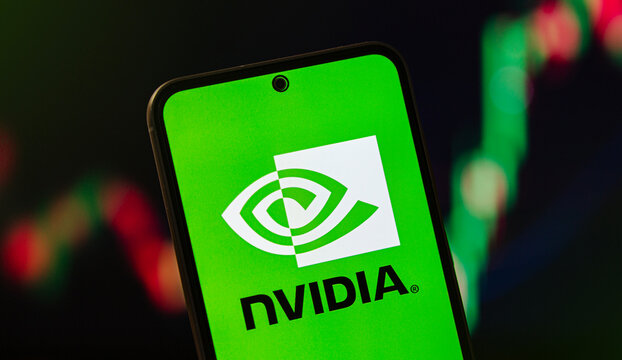 NVIDIA logo on smartphone screen with stock market chart in background. NVIDIA leading innovation in AI computing, GPU technology, and data processing power.