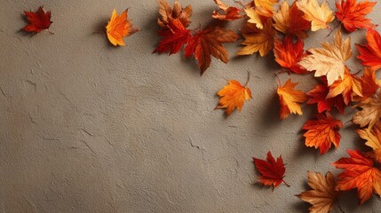 Obraz premium Fall leaves scattered on textured surface representing autumn sales and Thanksgiving shopping season